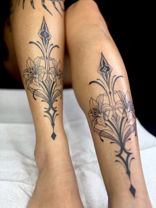 Symmetrical lilies tattoo by Valerie Mourningstar
